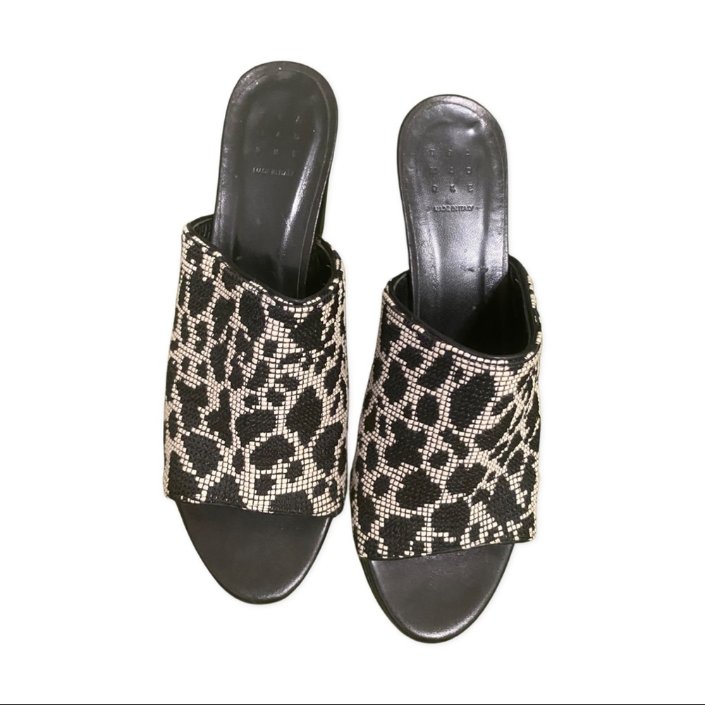 Trademark spotted slip on heels